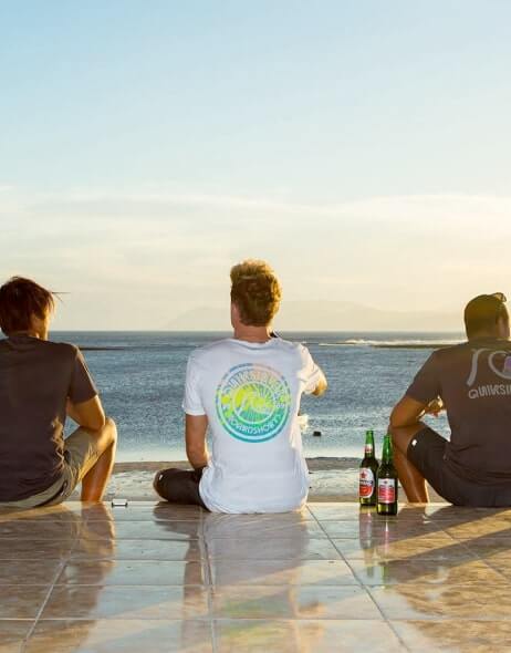 Mens facing the ocean